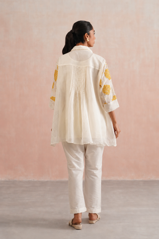 Mul chanderi applique and pearl embroidered oversized top paired with cotton pants