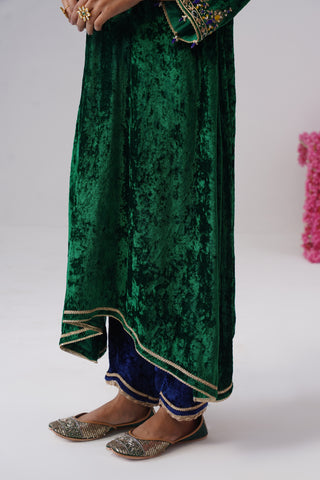 Electric Green zardozi embroidered velvet kurta paired with royal blue velvet pants and embroidered organza silk dupatta