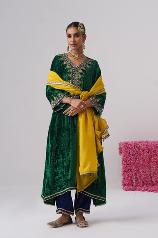 Electric Green zardozi embroidered velvet kurta paired with royal blue velvet pants and embroidered organza silk dupatta