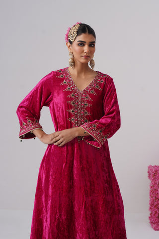 Rani Pink zardozi embroidered velvet kurta paired with red velvet pants and embroidered organza silk dupatta