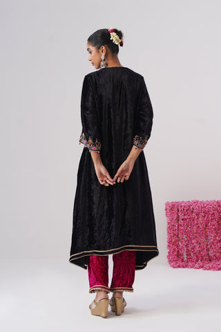 Black zardozi embroidered velvet kurta paired with rani pink velvet pants and embroidered organza silk dupatta