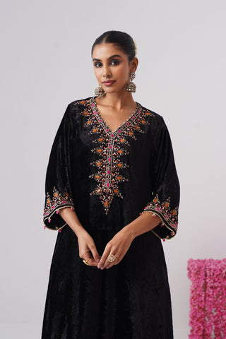 Black zardozi embroidered velvet kurta paired with rani pink velvet pants and embroidered organza silk dupatta