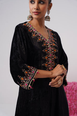 Black zardozi embroidered velvet kurta paired with rani pink velvet pants and embroidered organza silk dupatta
