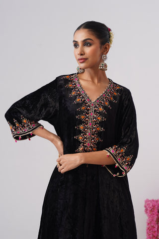 Black zardozi embroidered velvet kurta paired with rani pink velvet pants and embroidered organza silk dupatta