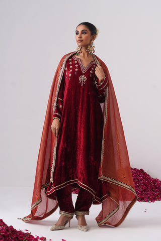 Red zardozi embroidered velvet kurta paired with velvet pants and embroidered tissue chanderi stripe dupatta