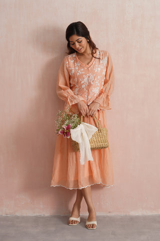 A graceful peach midi dress