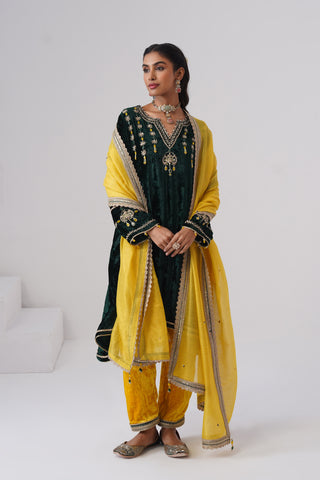 Emerald zardozi embroidered velvet kurta paired with yellow velvet pants and embroidered tissue chanderi stripe dupatta