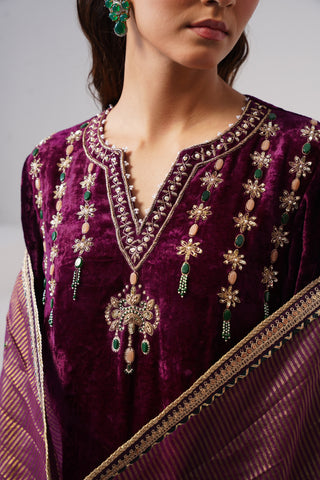 Deep Purple zardozi embroidered velvet kurta paired with emerald velvet pants and embroidered tissue chanderi stripe dupatta