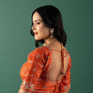 Vibrant Tangerine Organza Saree with Intricate Lattice Embroidery