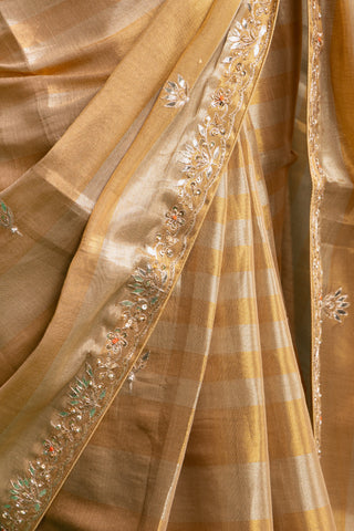 Elegant Champagne Gold Silk Saree with Subtle Metallic Checks and Floral Embellishments