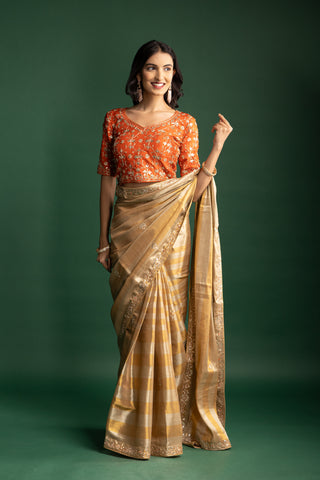 Elegant Champagne Gold Silk Saree with Subtle Metallic Checks and Floral Embellishments