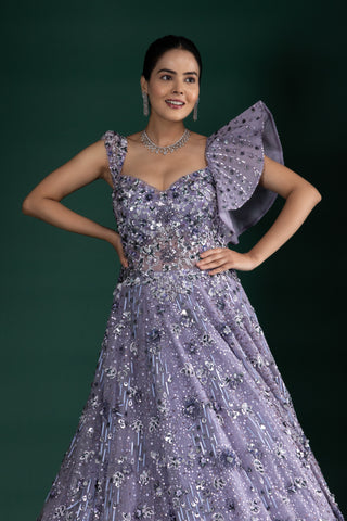 Shimmering Mystic Lavender Gown With Dramatic Shoulder Detail