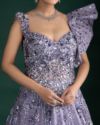 Shimmering Mystic Lavender Gown With Dramatic Shoulder Detail