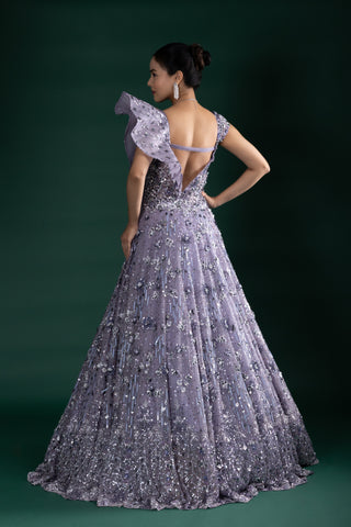 Shimmering Mystic Lavender Gown With Dramatic Shoulder Detail